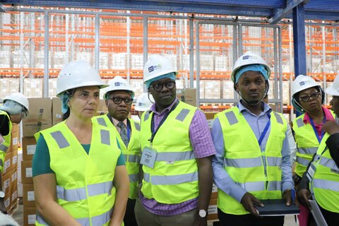 Participants at the regional learning exchange visit the National Medical Stores in Uganda. 